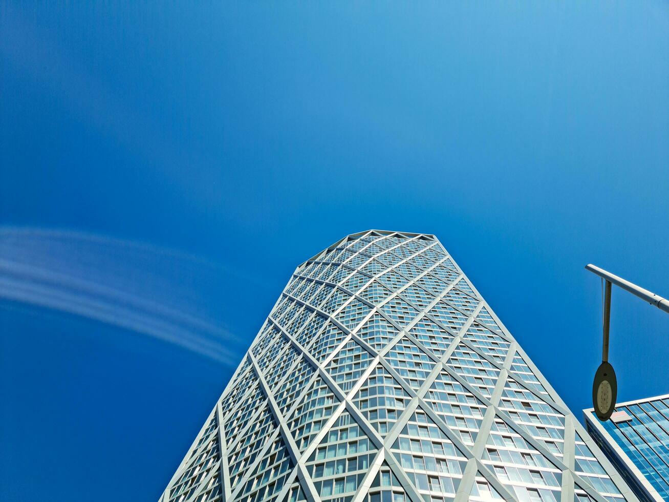 Low Angle View of Canary Wharf Buildings at Central London City of England Great Britain. The Footage Was Captured on 08-June-2023 During Clear Day. photo