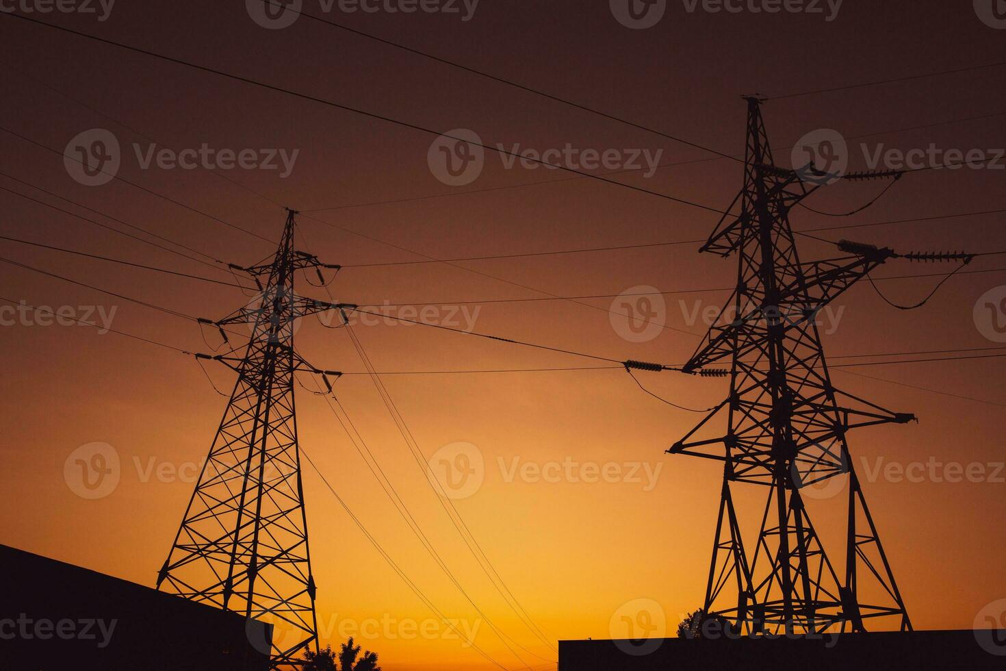 High-voltage power lines at sunset. Electricity distribution station.  electricity pylons on the background of the sky photo