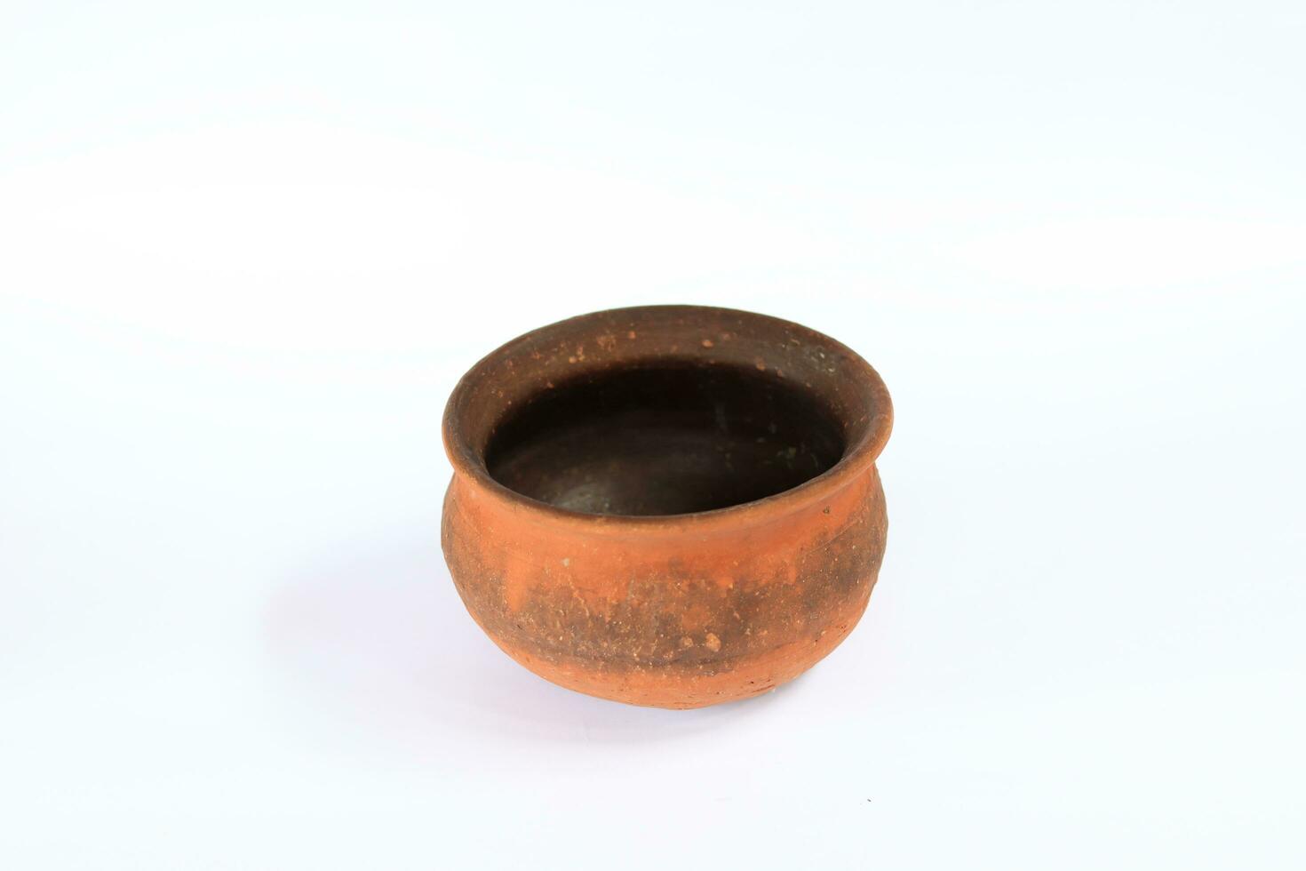 earthenware or clay jug on a white background photo