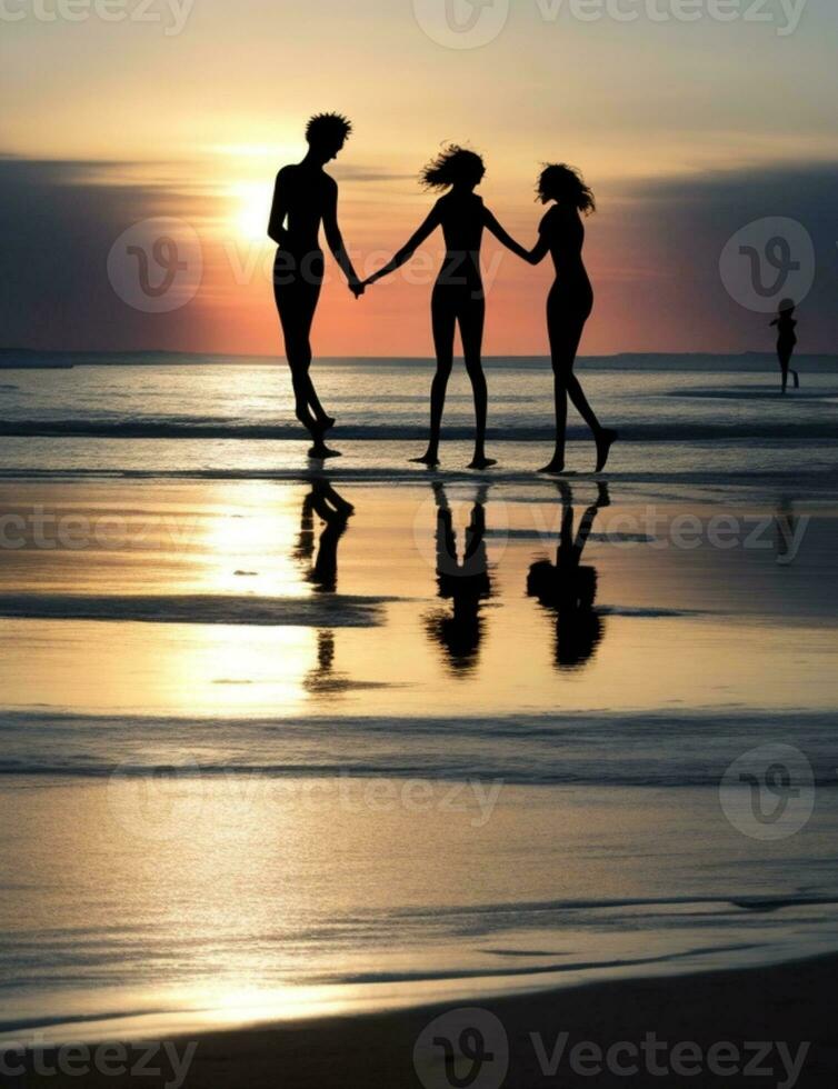 Silhouettes of friends enjoying beach activities together photo