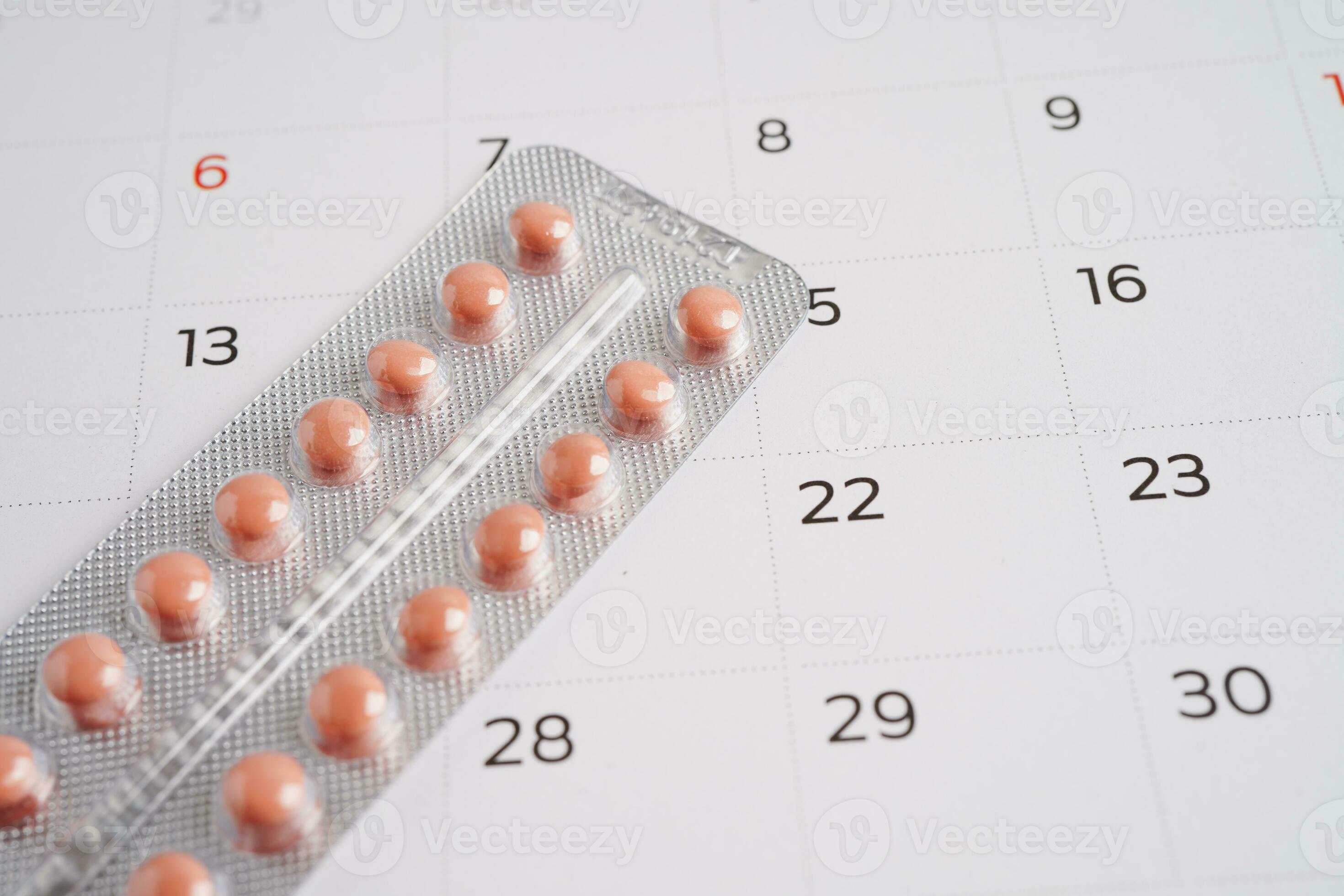 Birth control pills for female on calendar, ovulation day. 26267594