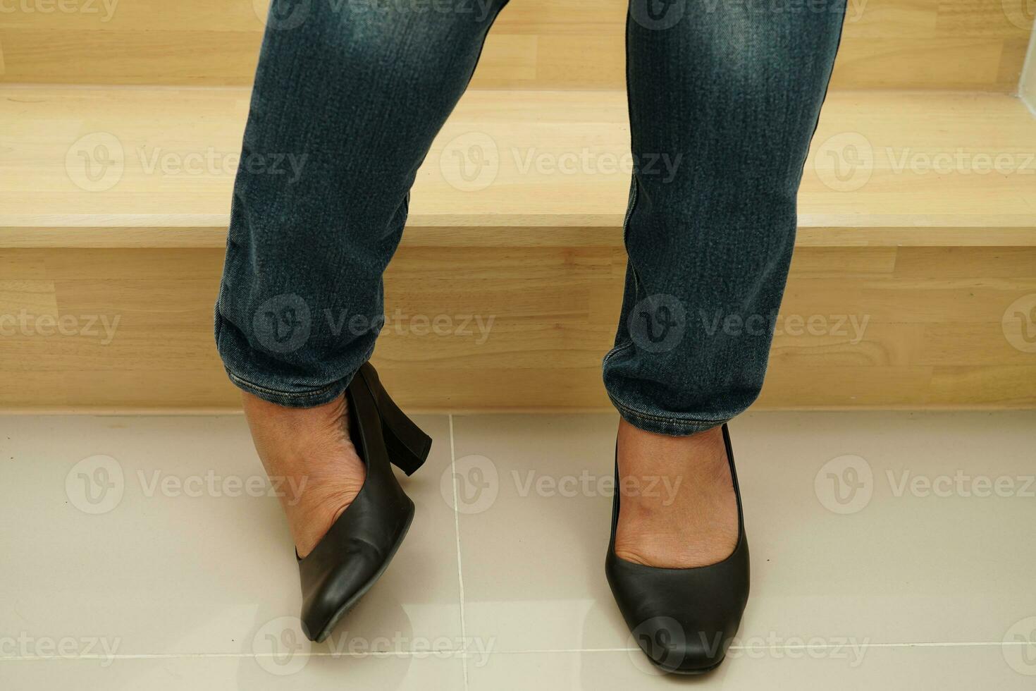 Asian business woman pain ankle, foot with leg cramp and fall down the stairs because slippery surfaces in office. photo