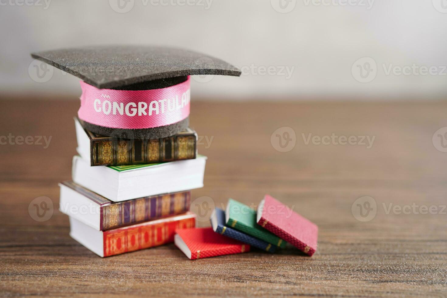 Graduation hat on book with copy space, learning university education concept. photo