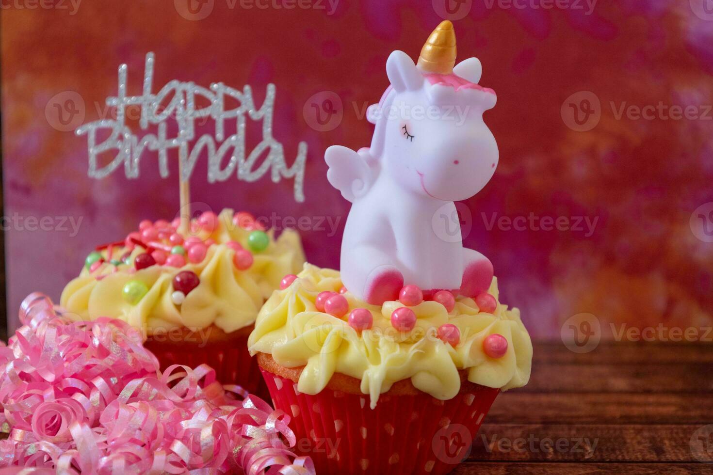Happy birthday cupcakes with ribbon and a unicorn photo