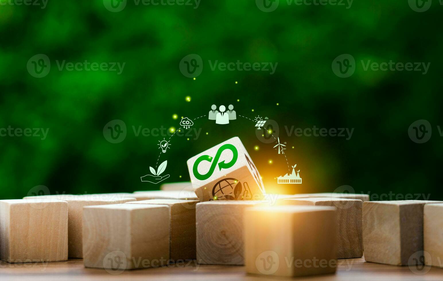 circular economy icons in wooden cubes. economic system that aims to minimize waste and maximize resource efficiency, sustainable strategies to eliminate waste and pollution for future business growth photo