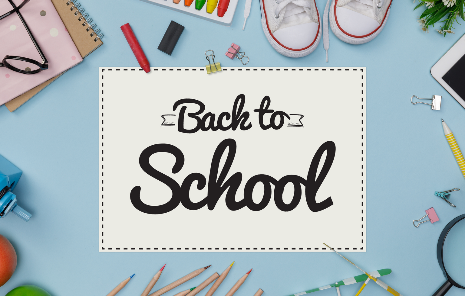 Education's accessories with backpack, student books, shoes, colorful crayon on blackboard background with copy space mockup template psd