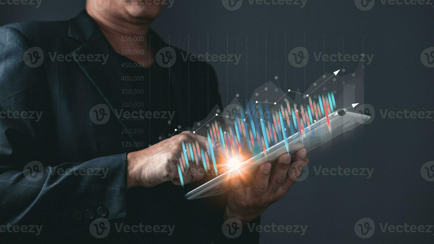 man use taplet graphs and progress of business and analyze financial,and investment.Use technology to plan strategy to success goals and growth stock.online business,e-commerce,online marketing. photo