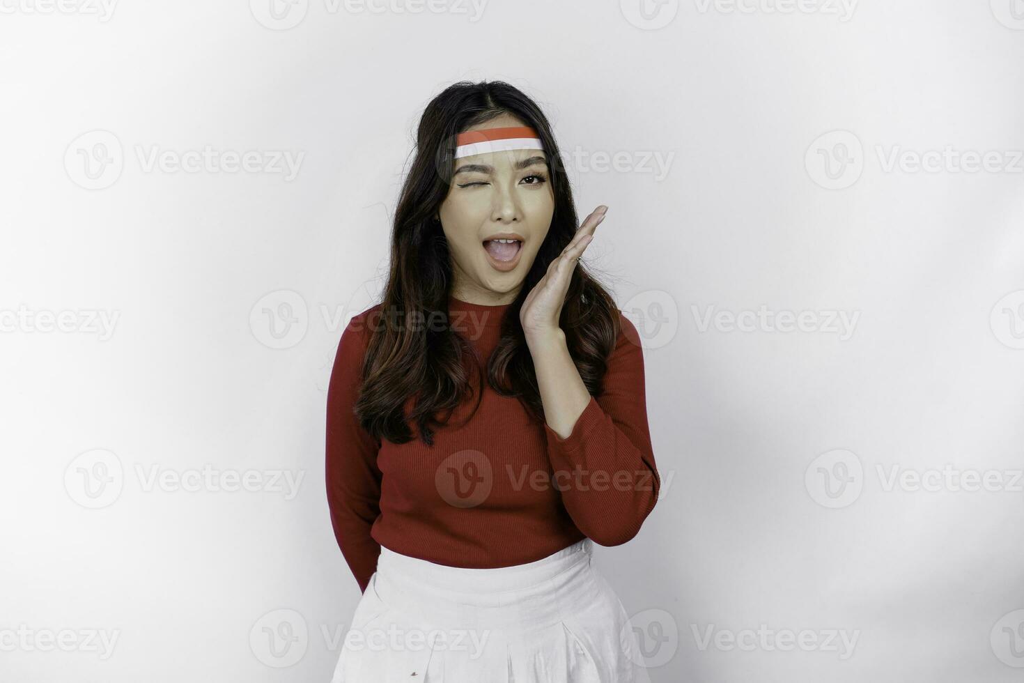 Happy young Asian woman is smiling, isolated on white background. Indonesian independence day concept photo