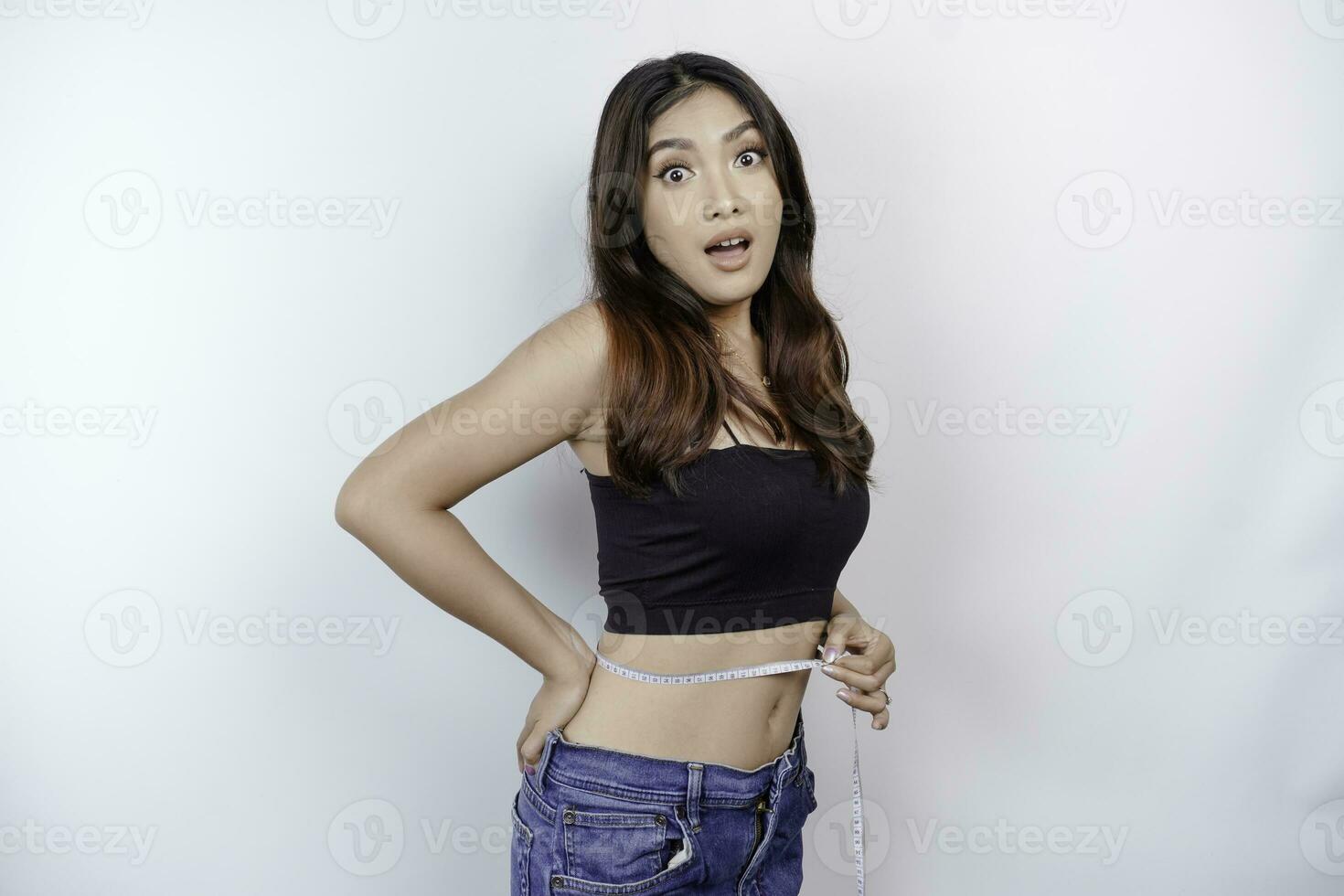 girl measuring her waist measuring tape, Stock image