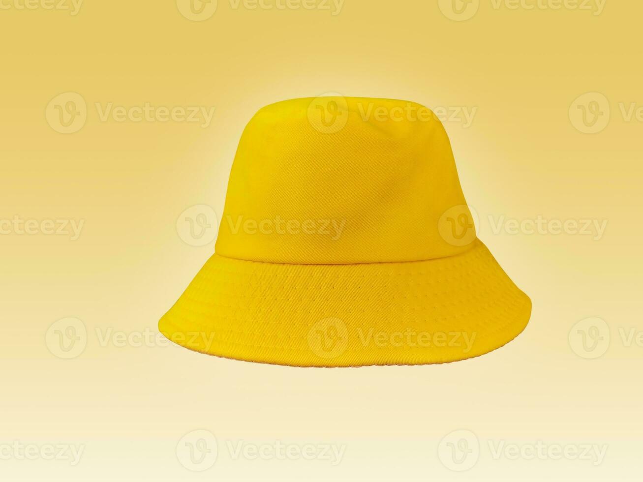 yellow bucket hat isolated on light yellow background photo