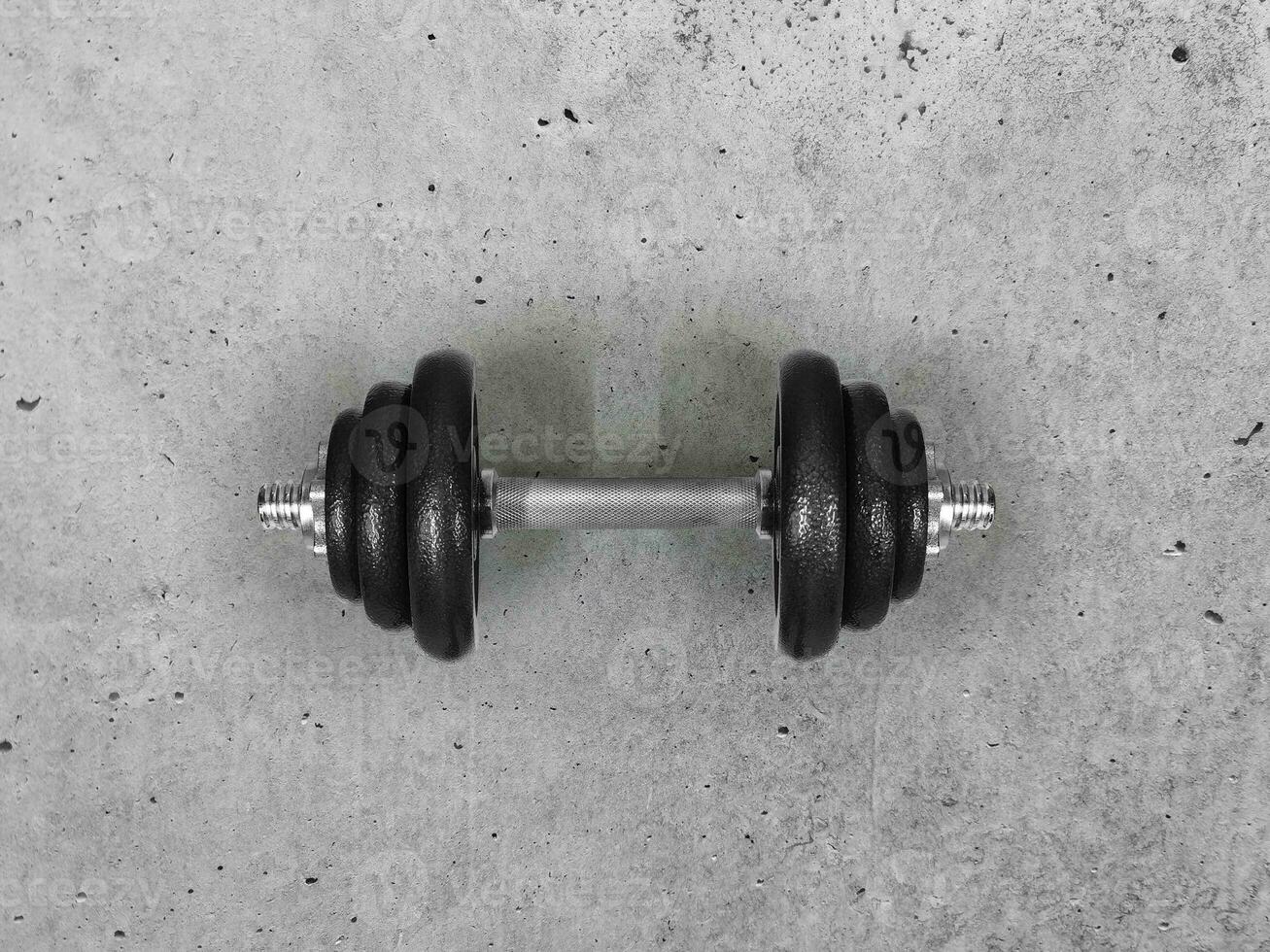 Dumbbells placed on the cement floor  top view photo