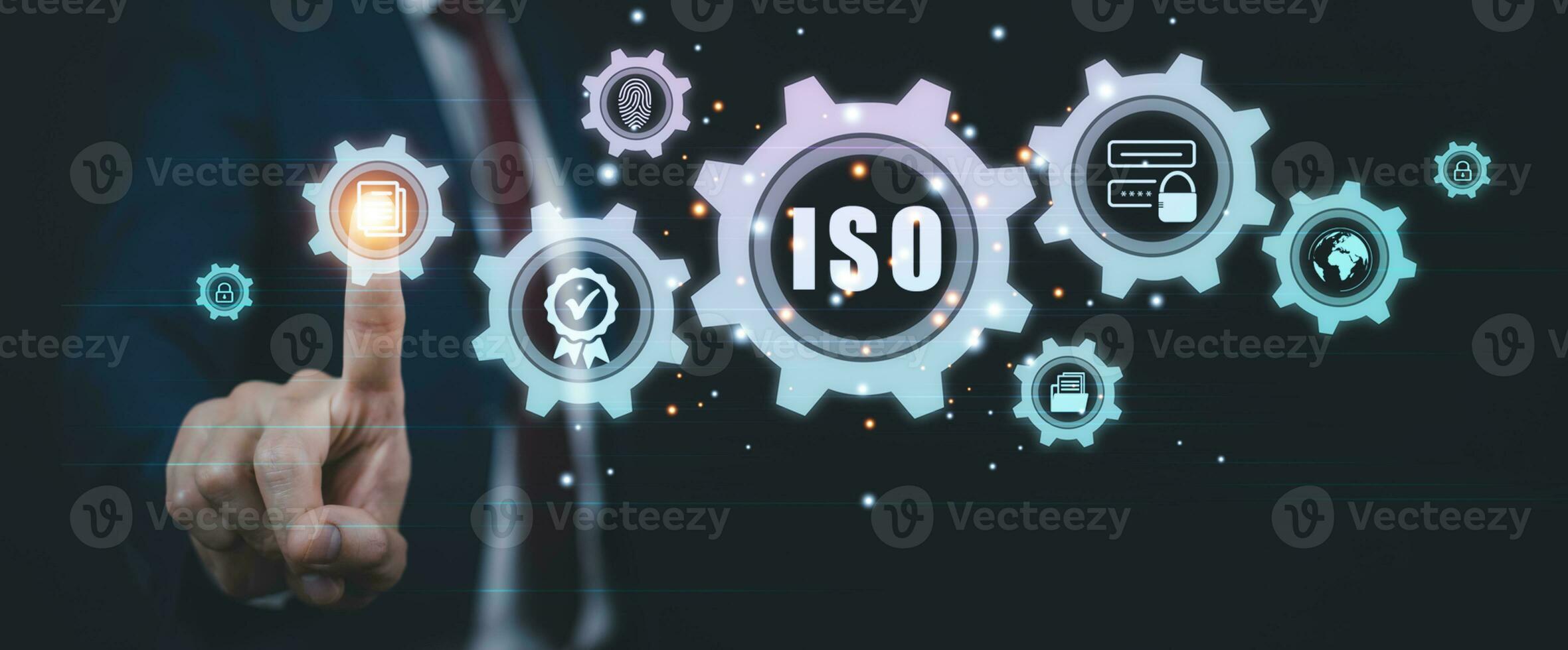 Hand hold Laptop with ISO standards quality control concept, assurance warranty in dark background, Cogs and gear wheel mechanisms, identification information security and encryption, secure access photo