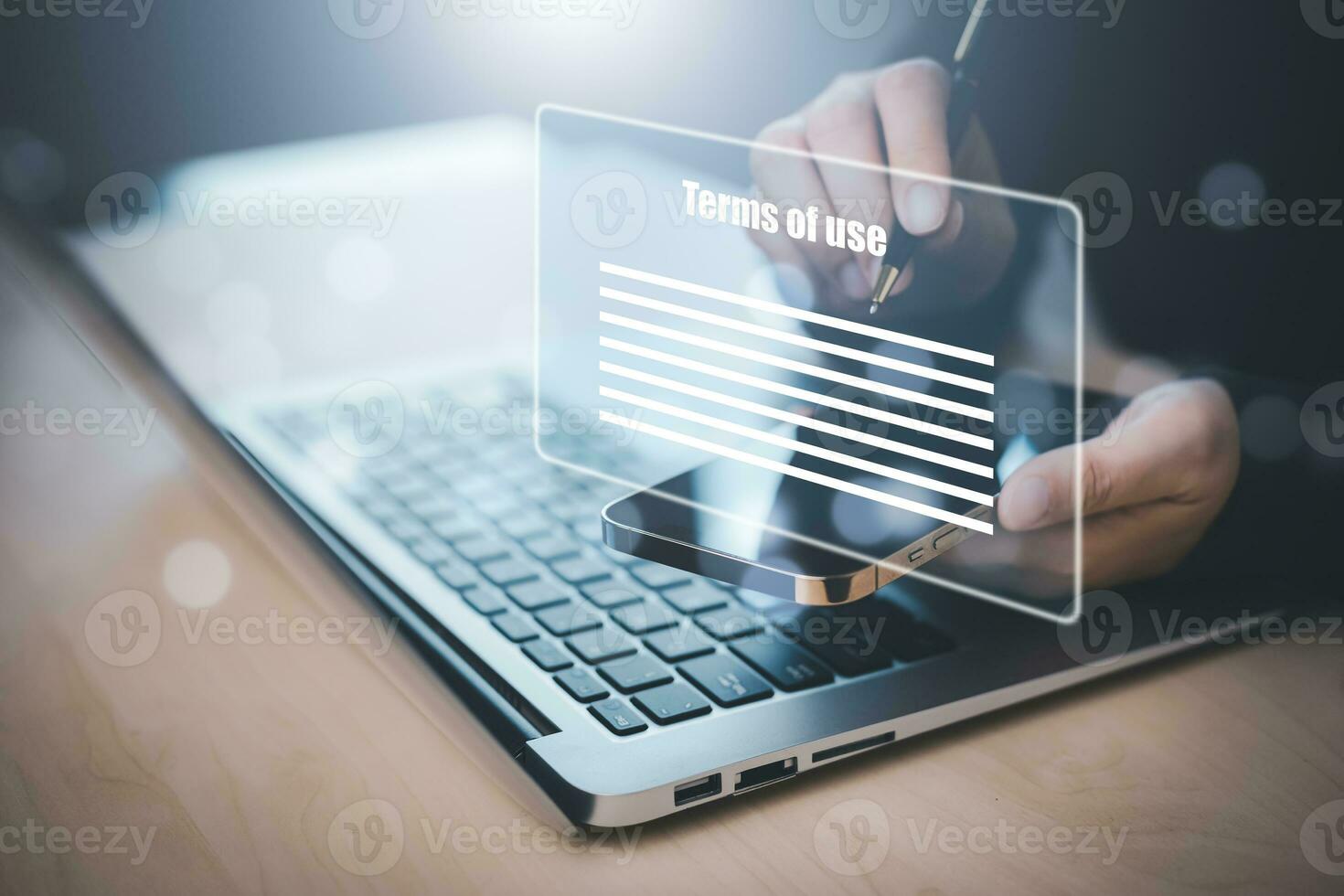 Man using a laptop with a graph of Terms of use concept, online banking check budget planning concept banner for website header design,Terms of use business concept. Terms and conditions of contract. photo