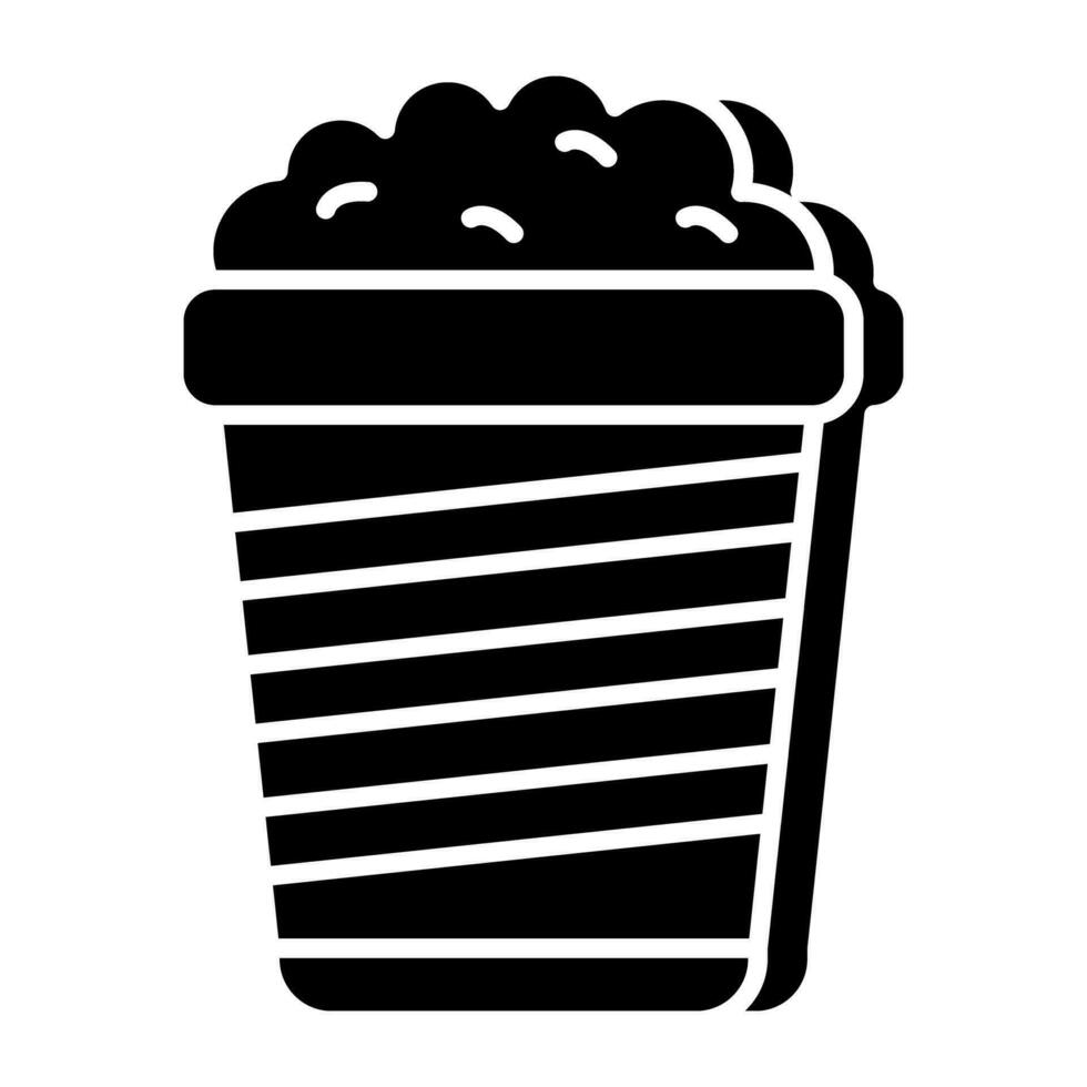 A solid design icon of popcorn bucket vector