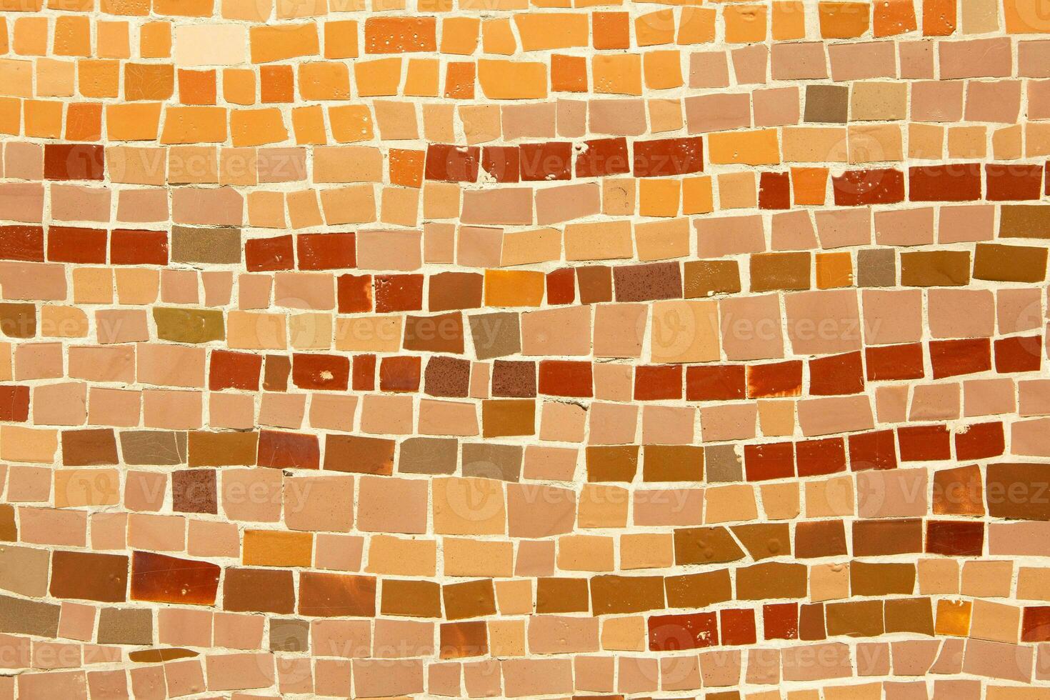 Colorful ceramic mosaic on the walls of the building. Abstract background and texture for design. photo