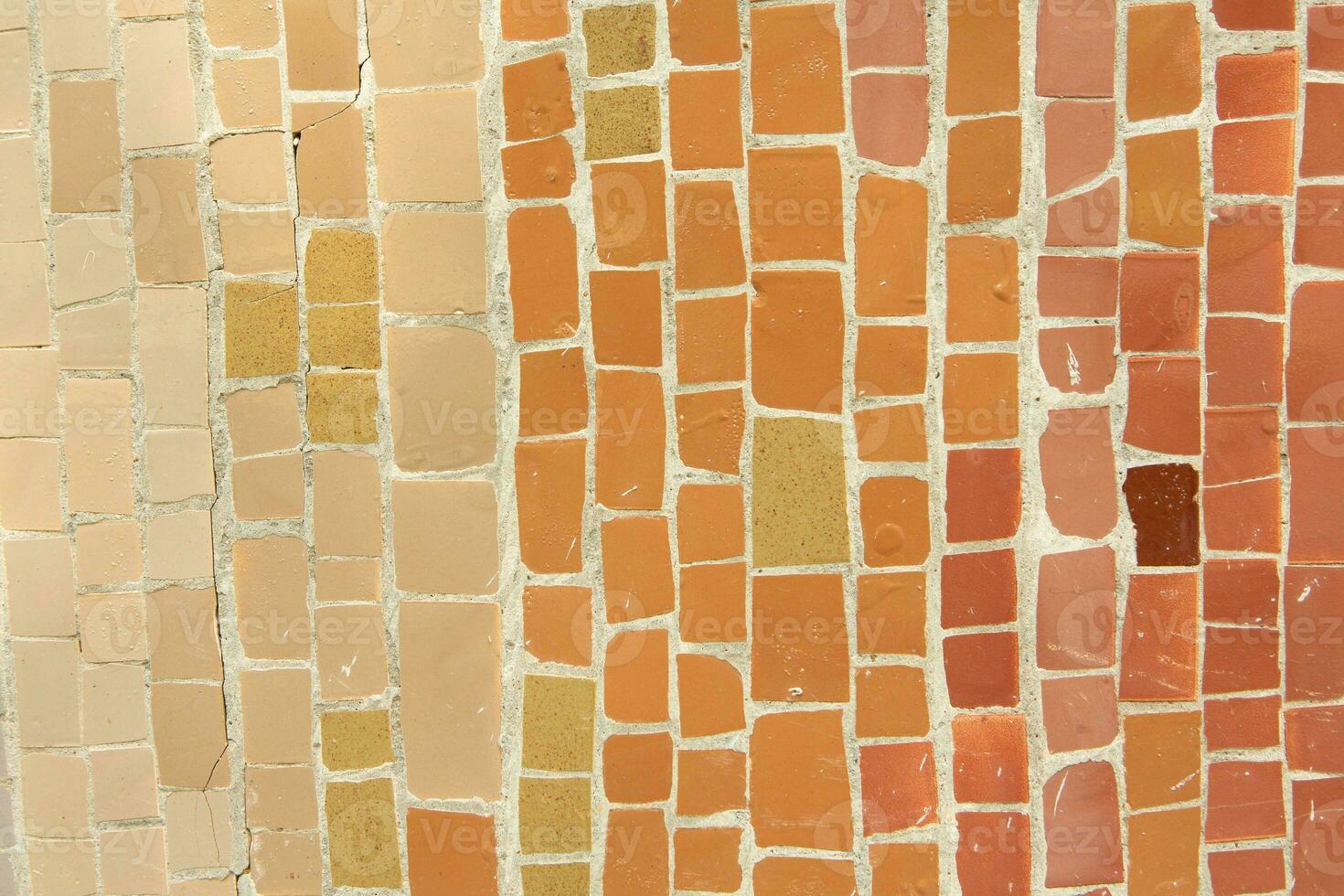 Colorful ceramic mosaic on the walls of the building. Abstract background and texture for design. photo