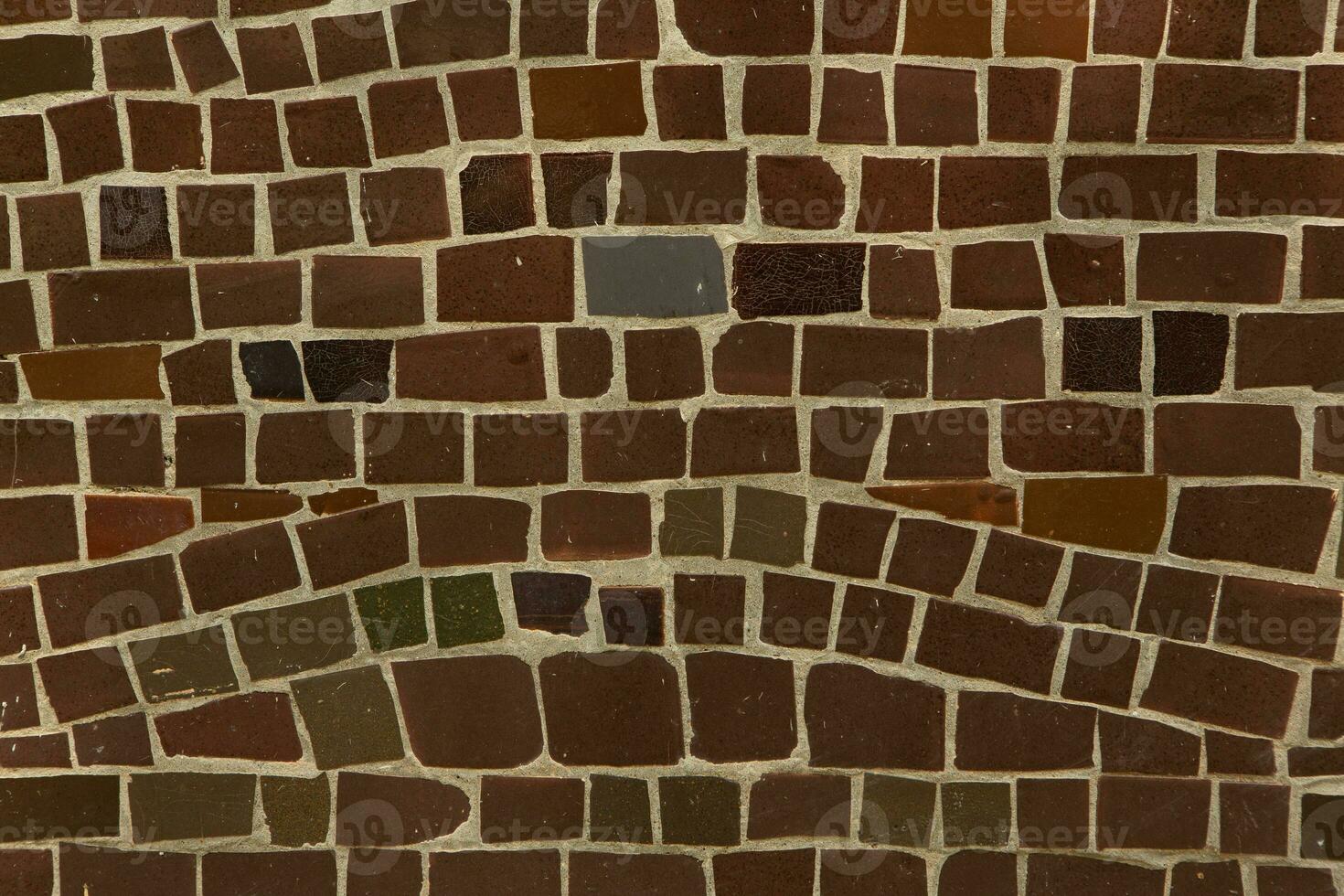 Colorful ceramic mosaic on the walls of the building. Abstract background and texture for design. photo