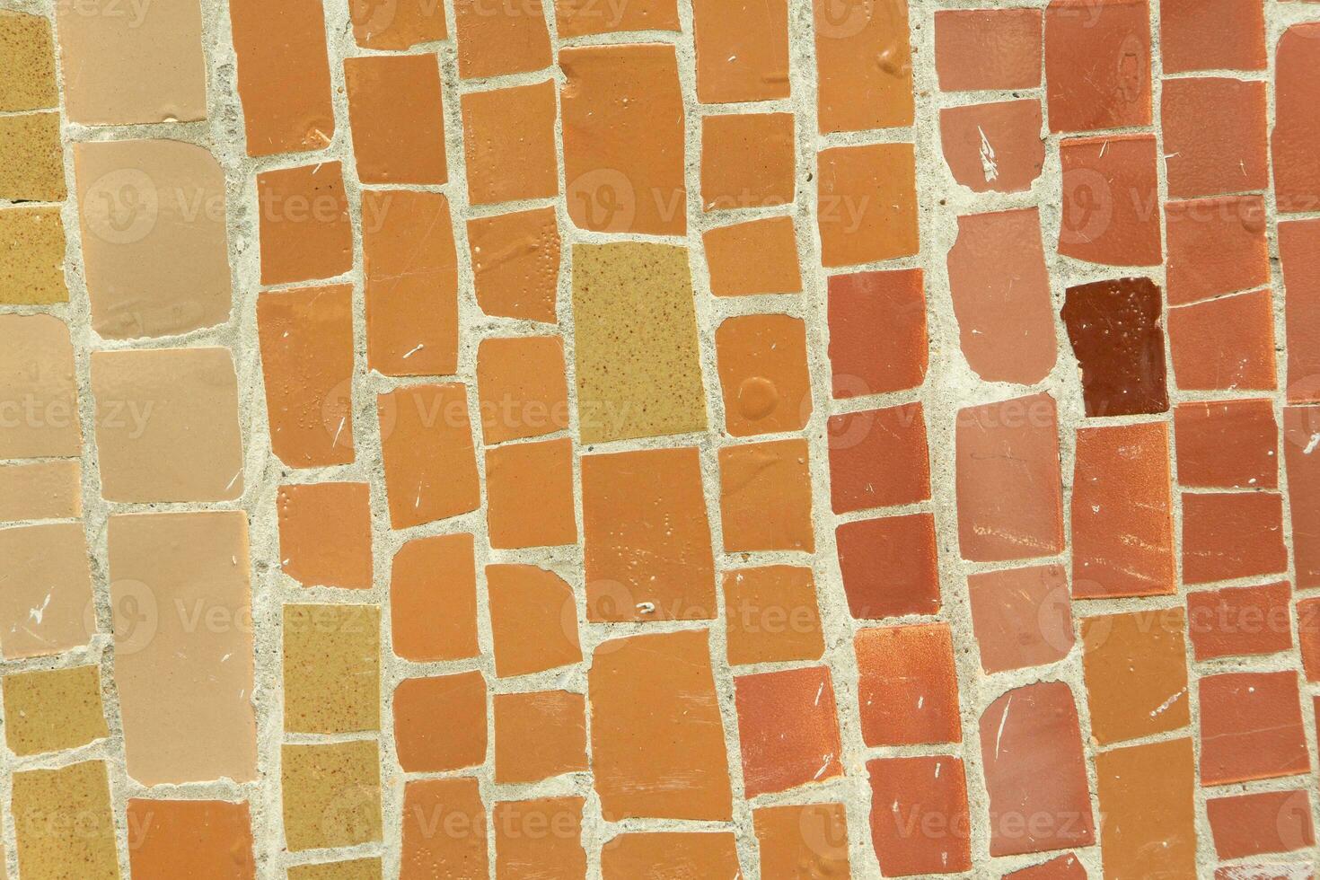 Colorful ceramic mosaic on the walls of the building. Abstract background and texture for design. photo