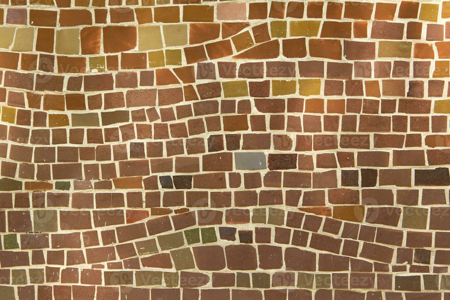 Colorful ceramic mosaic on the walls of the building. Abstract background and texture for design. photo