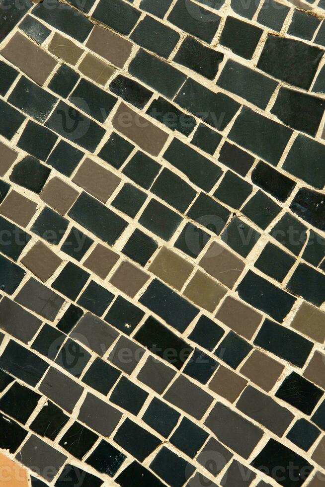 Colorful ceramic mosaic on the walls of the building. Abstract background and texture for design. photo