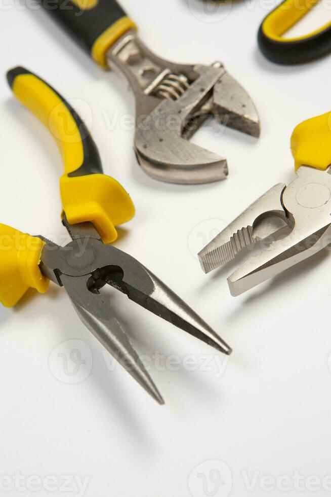 Set of tools for repair in a case on a white background. Assorted work or construction tools. Wrenches, Pliers, screwdriver. Top view photo