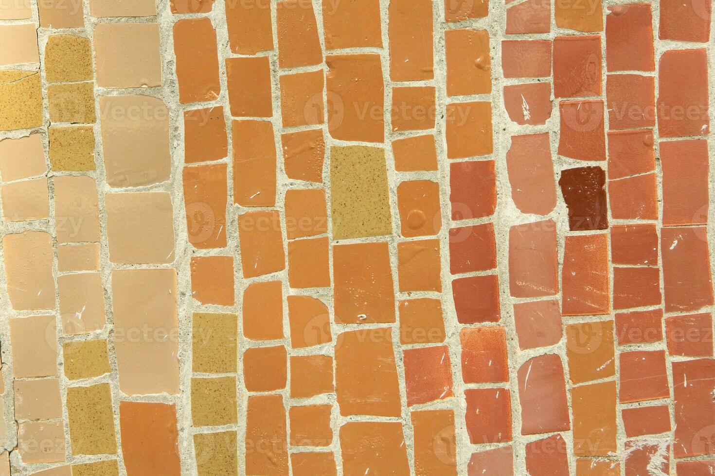 Colorful ceramic mosaic on the walls of the building. Abstract background and texture for design. photo