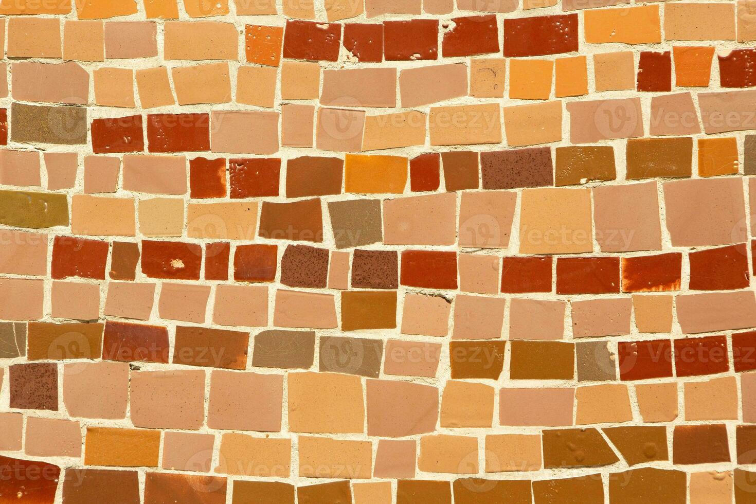 Colorful ceramic mosaic on the walls of the building. Abstract background and texture for design. photo