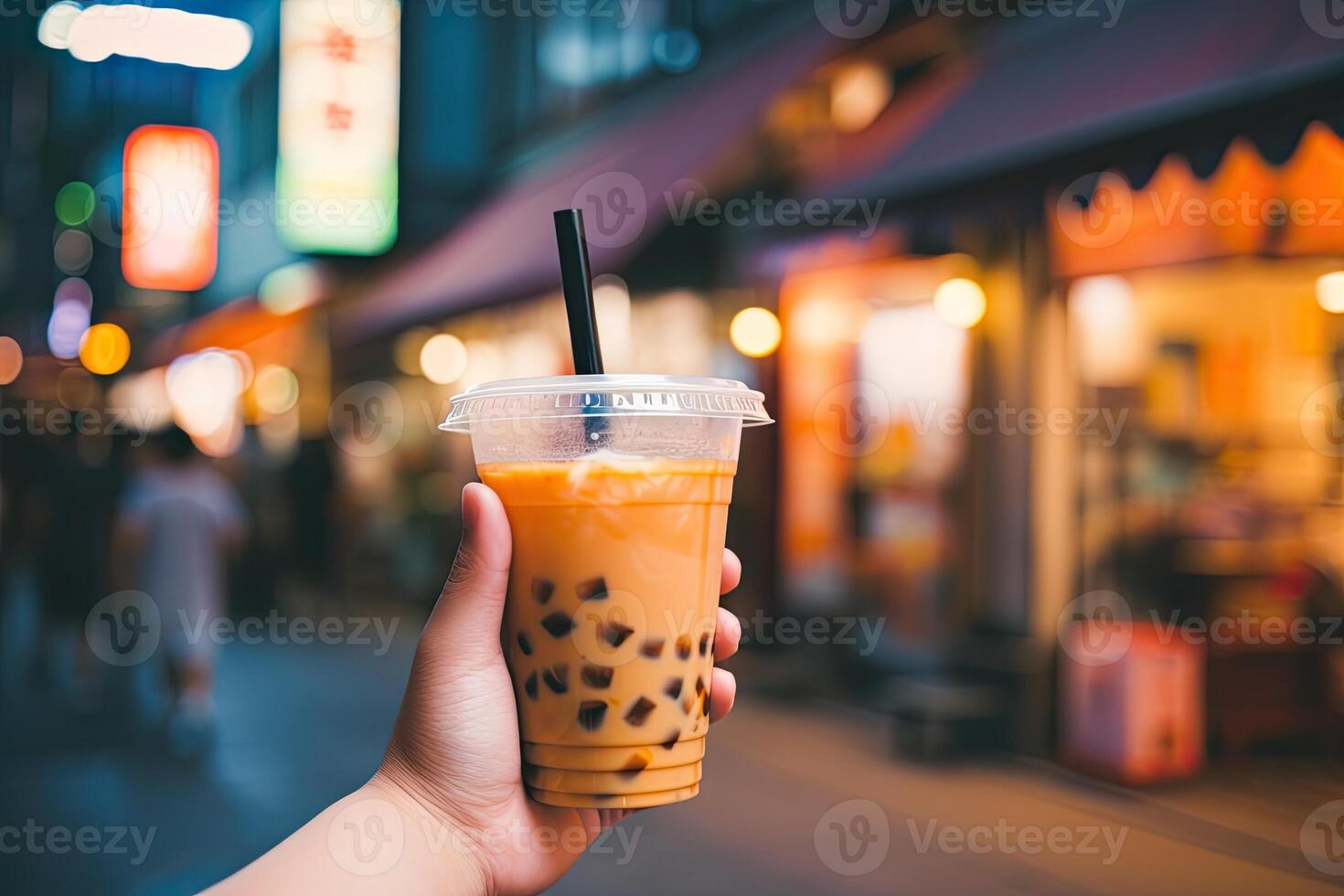 illustration of hand holding Taiwan milk tea and blurry background photo