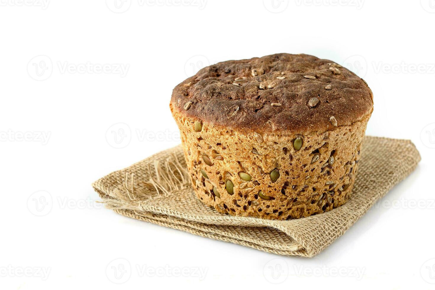 A slice of homemade grain bread on white photo