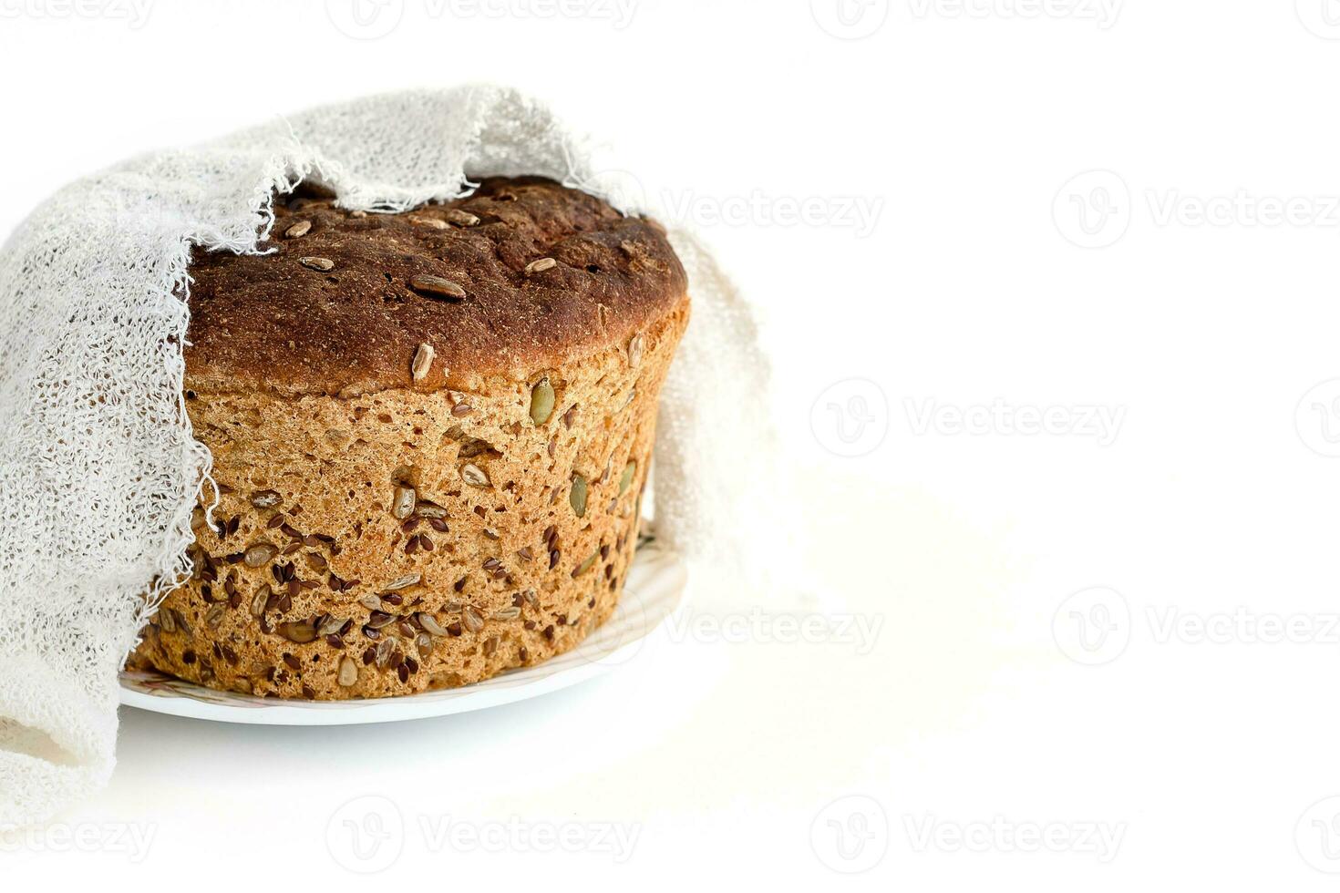 A slice of homemade grain bread on white photo