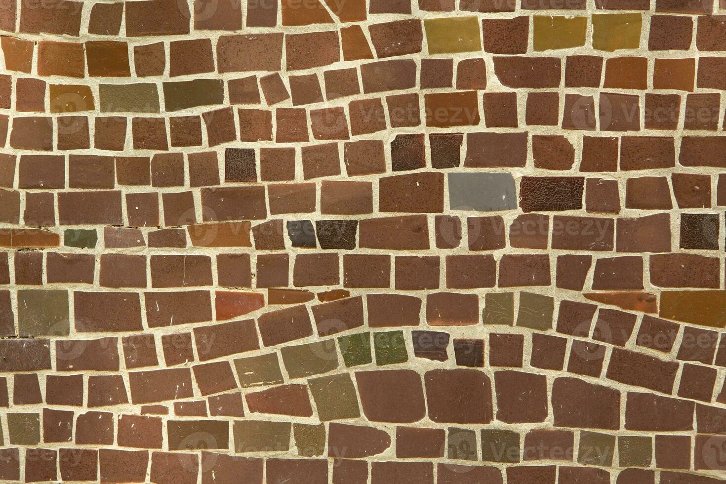 Colorful ceramic mosaic on the walls of the building. Abstract background and texture for design. photo