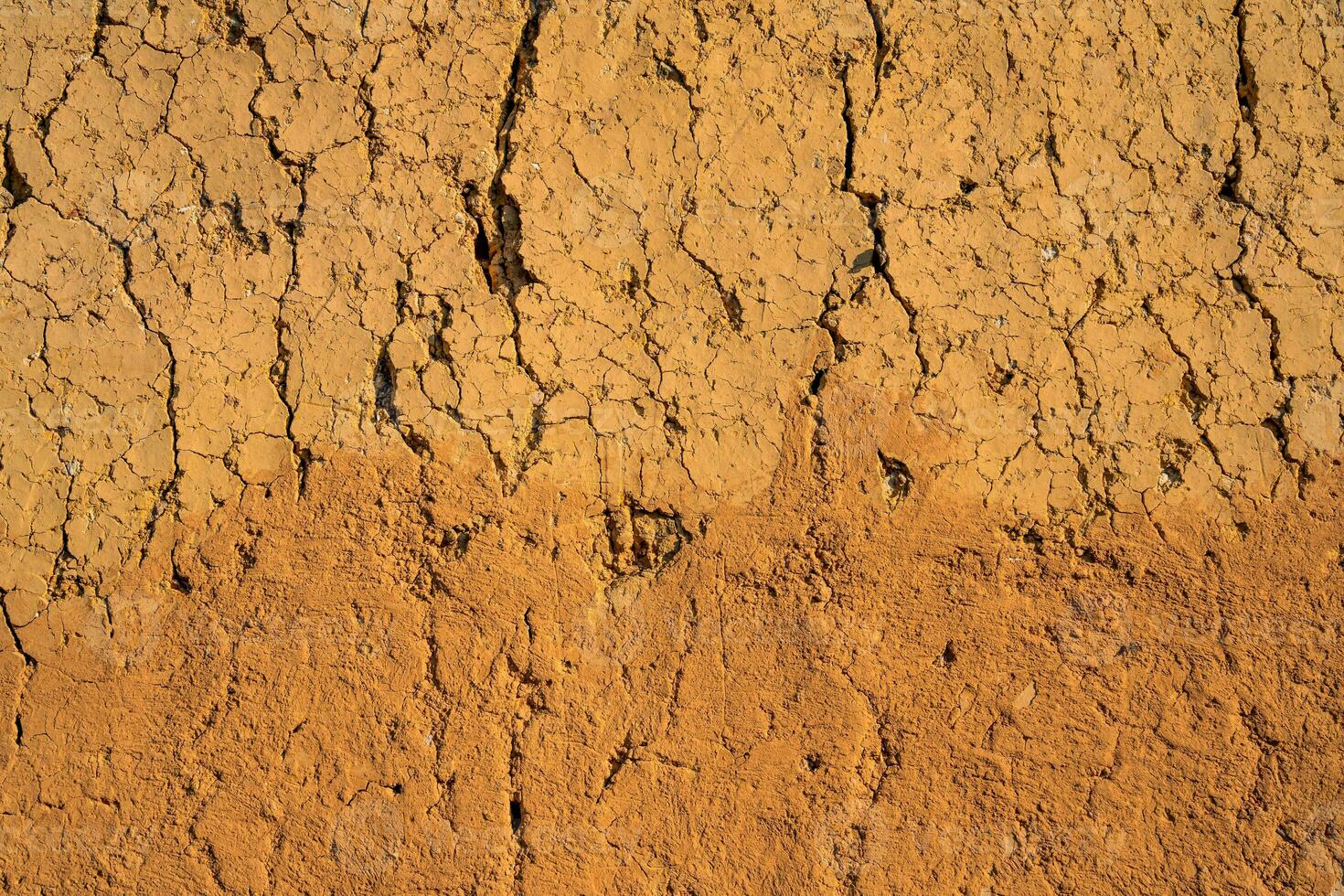 Soil wall texture of old clay house structure. One kind of material make house wall in North Vietnam photo