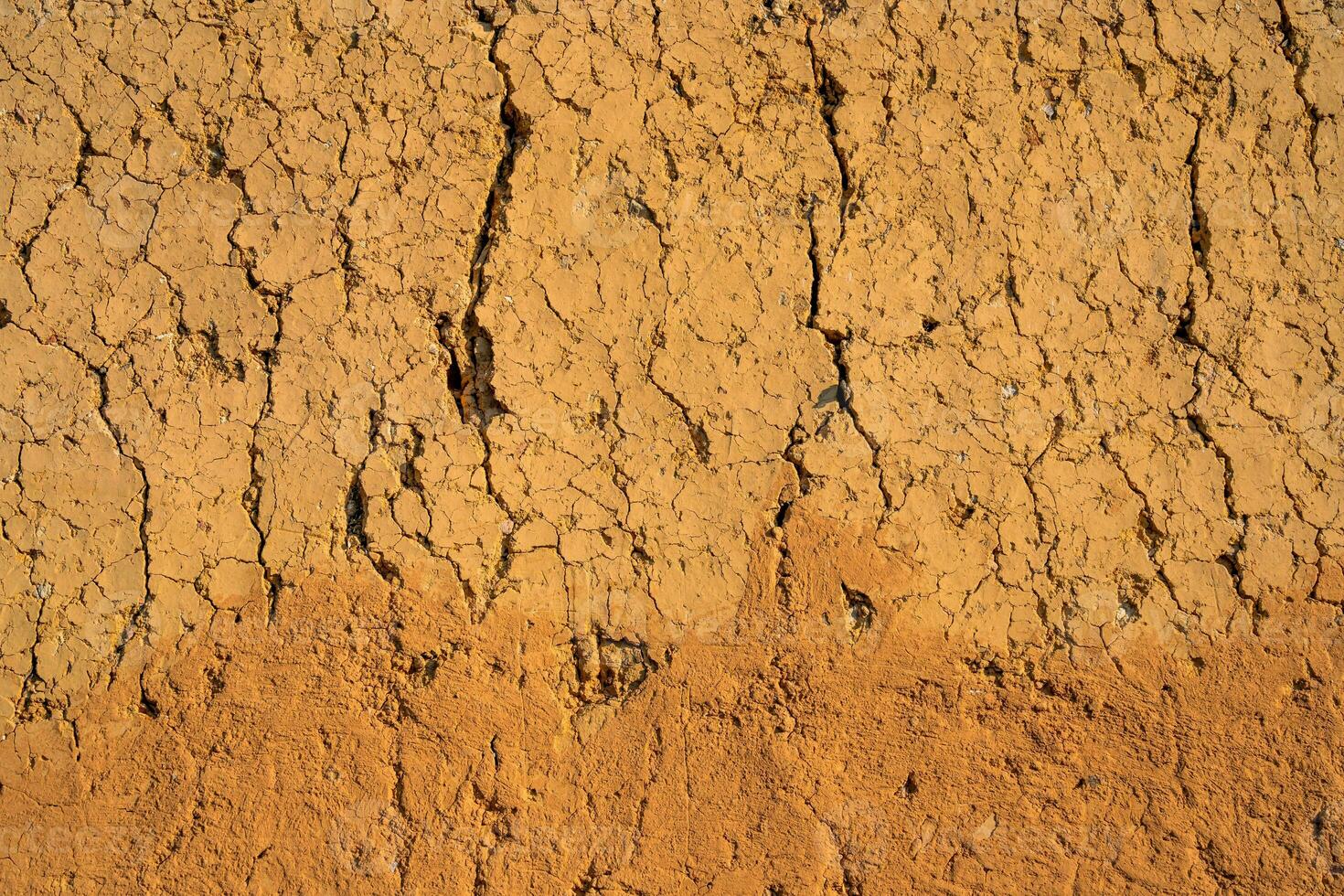 Soil wall texture of old clay house structure. One kind of material make house wall in North Vietnam photo