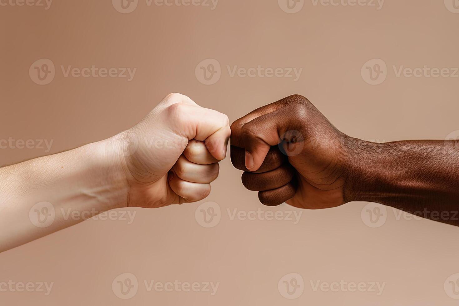 close up of a fist bump isolated on beige background, hands and teamwork, support or collaboration for team building, solidarity or unity, hand connection, partnership or greeting. photo