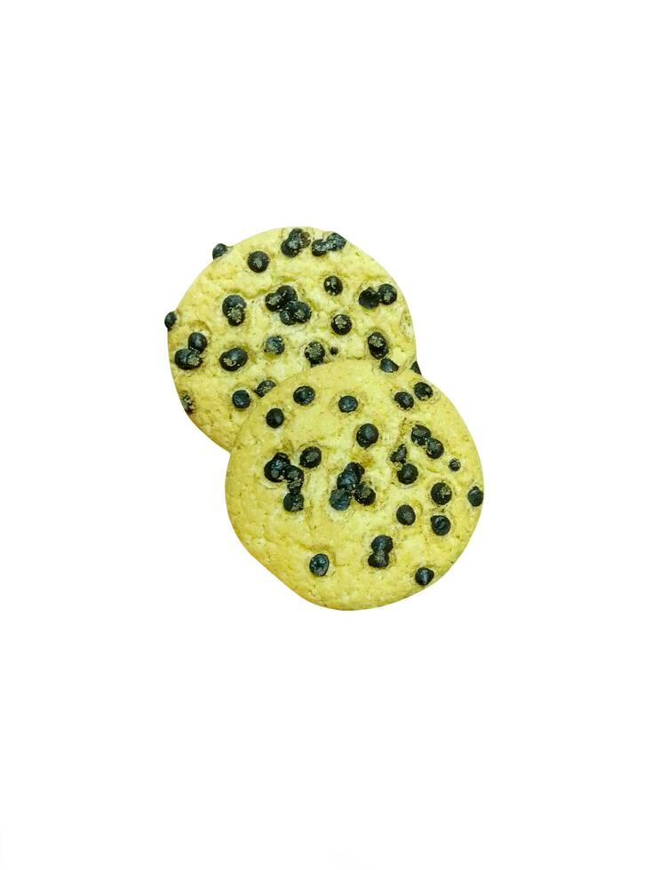 Yellow cookies covered with chocolate chips on a white background photo