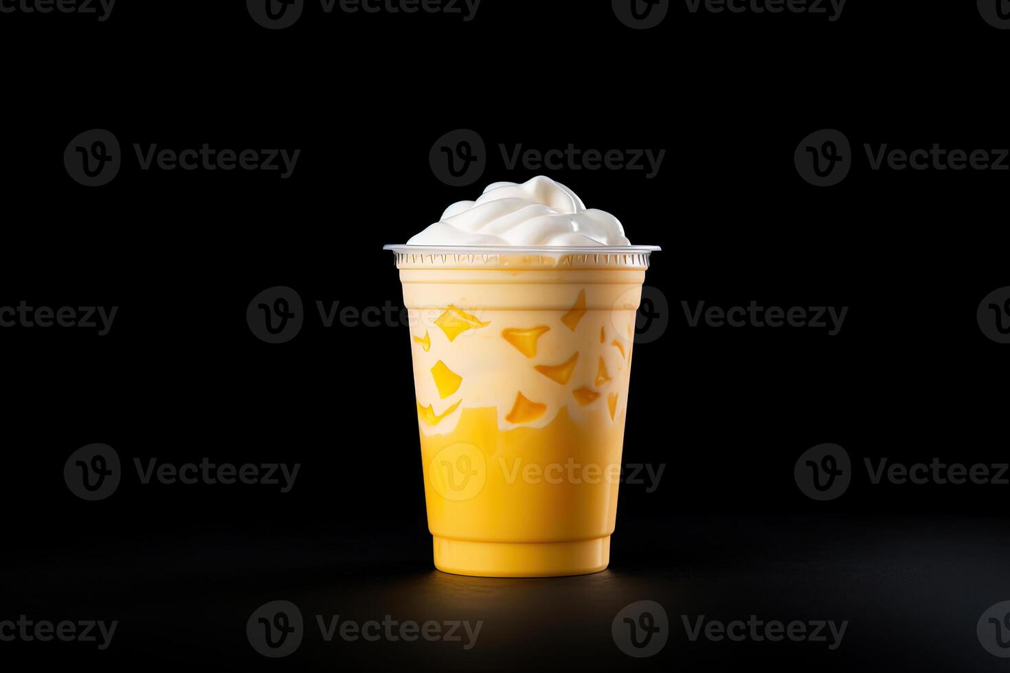 Mango smoothie milkshake in plastic takeaway cup isolated on dark background. photo
