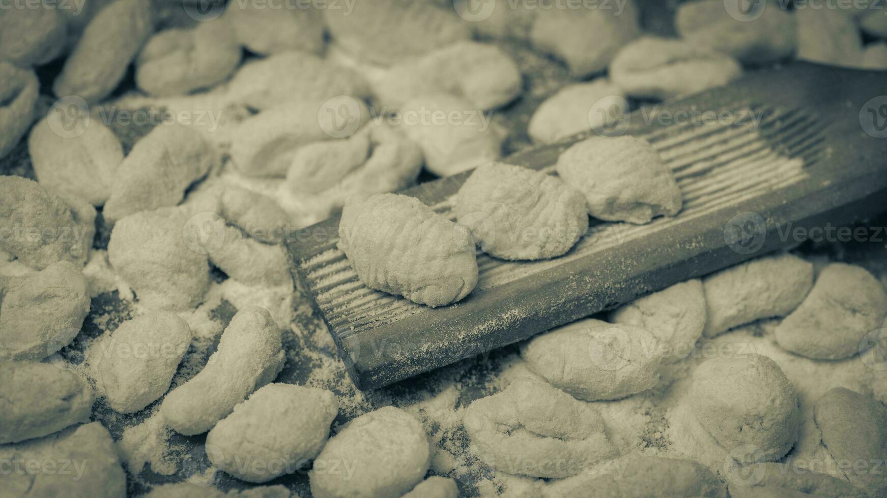 Cook homemade gnocchi on the table, Italian tradition photo