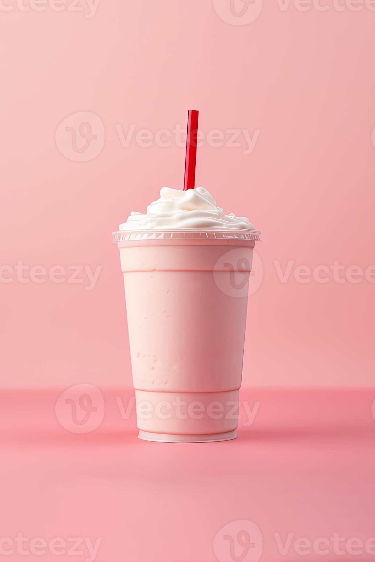 Strawberry milkshake in plastic takeaway cup isolated on white