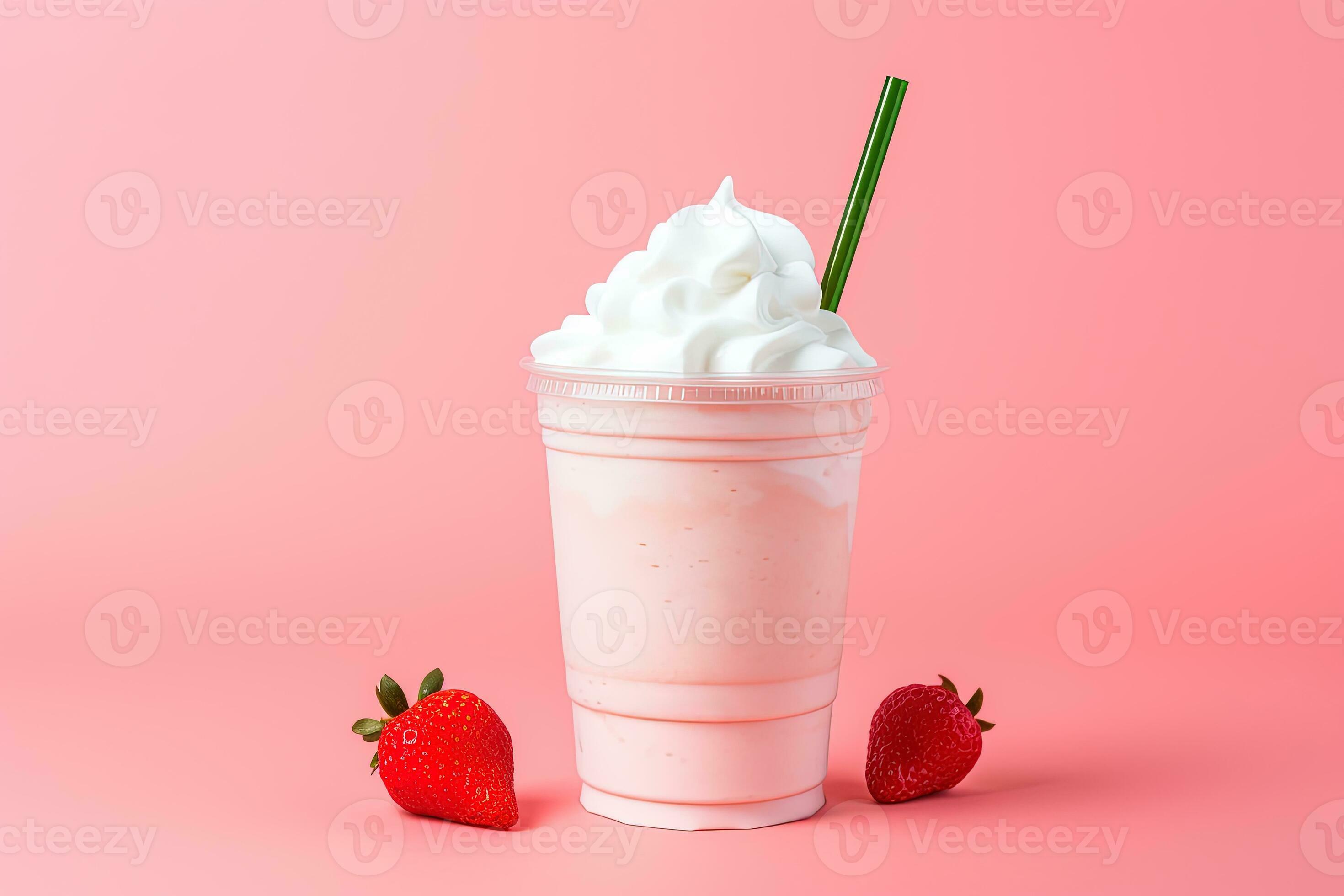 Plastic cup of milkshake with strawberries isolated on white Stock