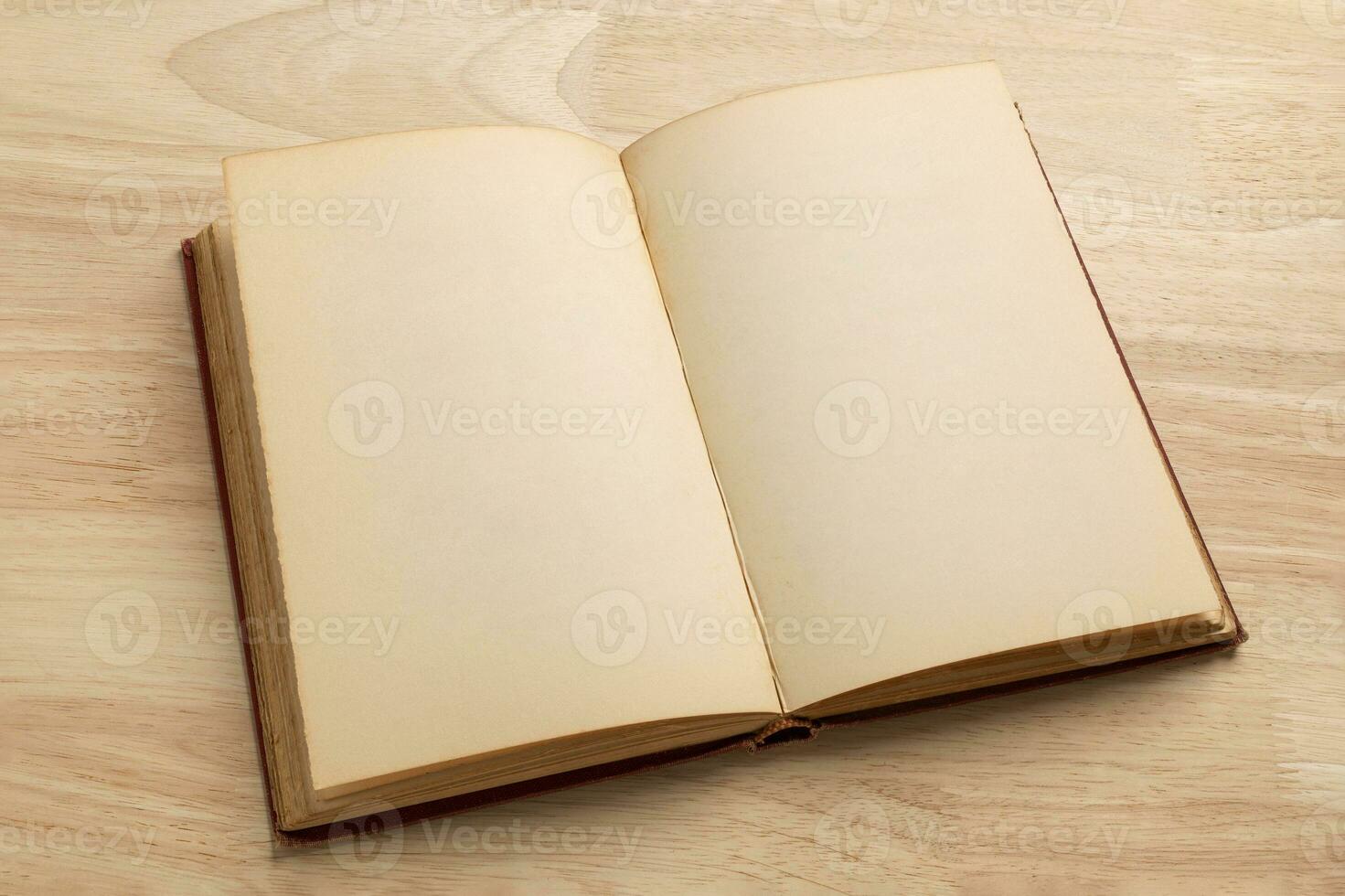 open old book on wooden table for mockup blank template photo