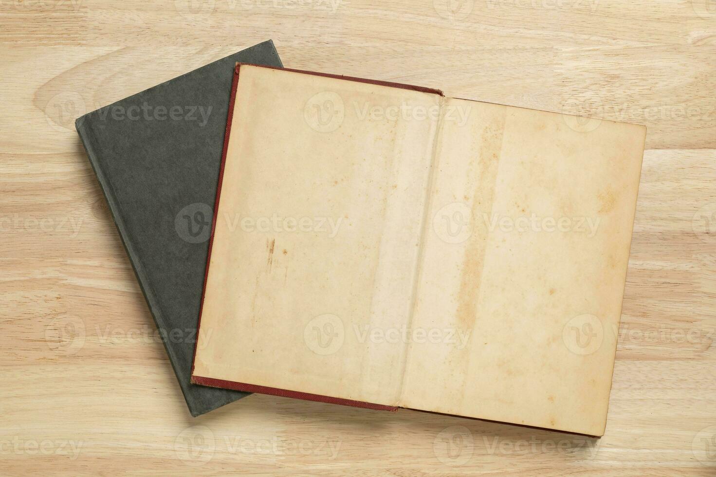 stack of open old book on wooden table for mockup blank template photo