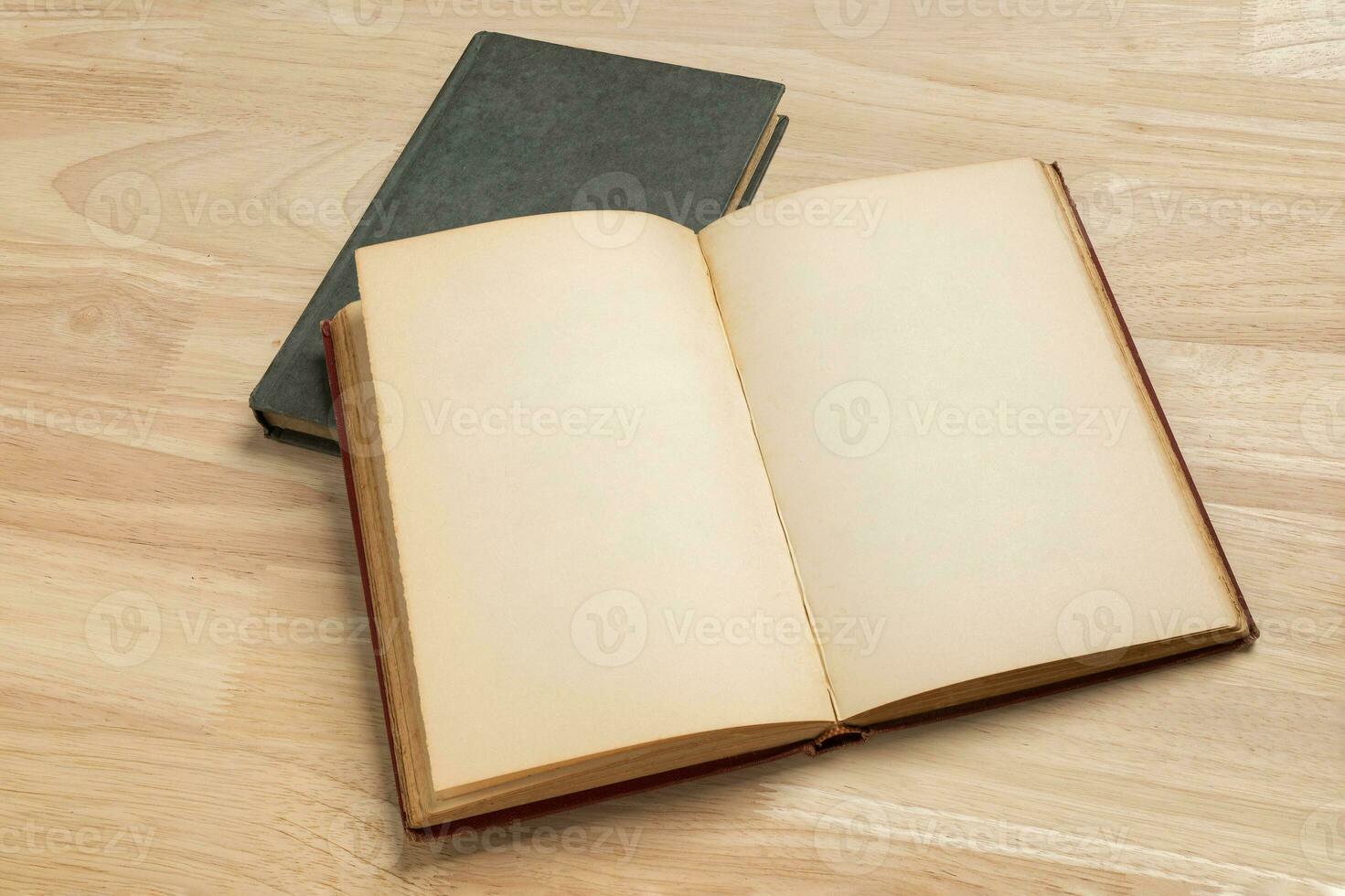 stack of open old book on wooden table for mockup blank template photo