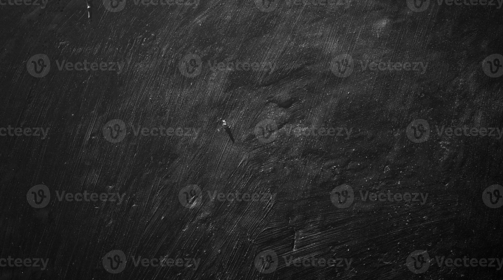 Black wall background of natural paintbrush stroke textured cement or stone old. concrete texture as a concept of horror and Halloween photo