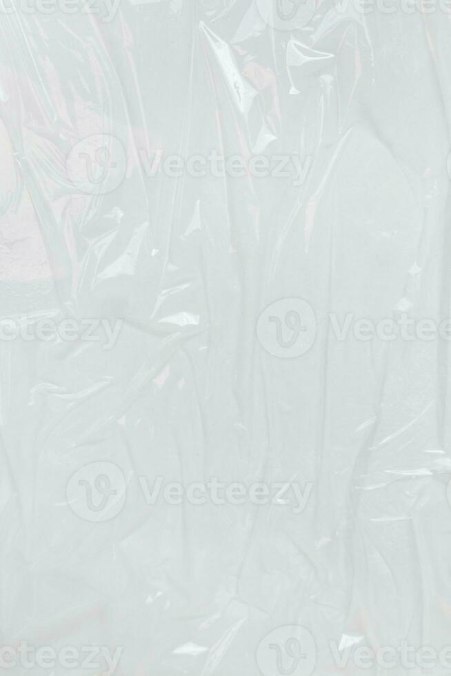 Vertical transparant wrinkled plastic, white plastic or polyethylene bag texture, macro, white background photo