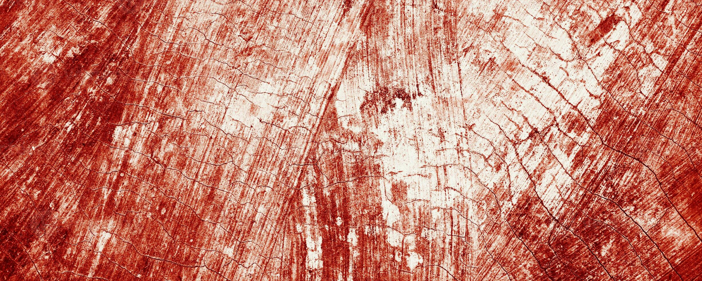 Splatters of red paint resemble fresh blood, their jagged edges contributing to a sense of unease. The stains, reminiscent of Halloween horrors. photo