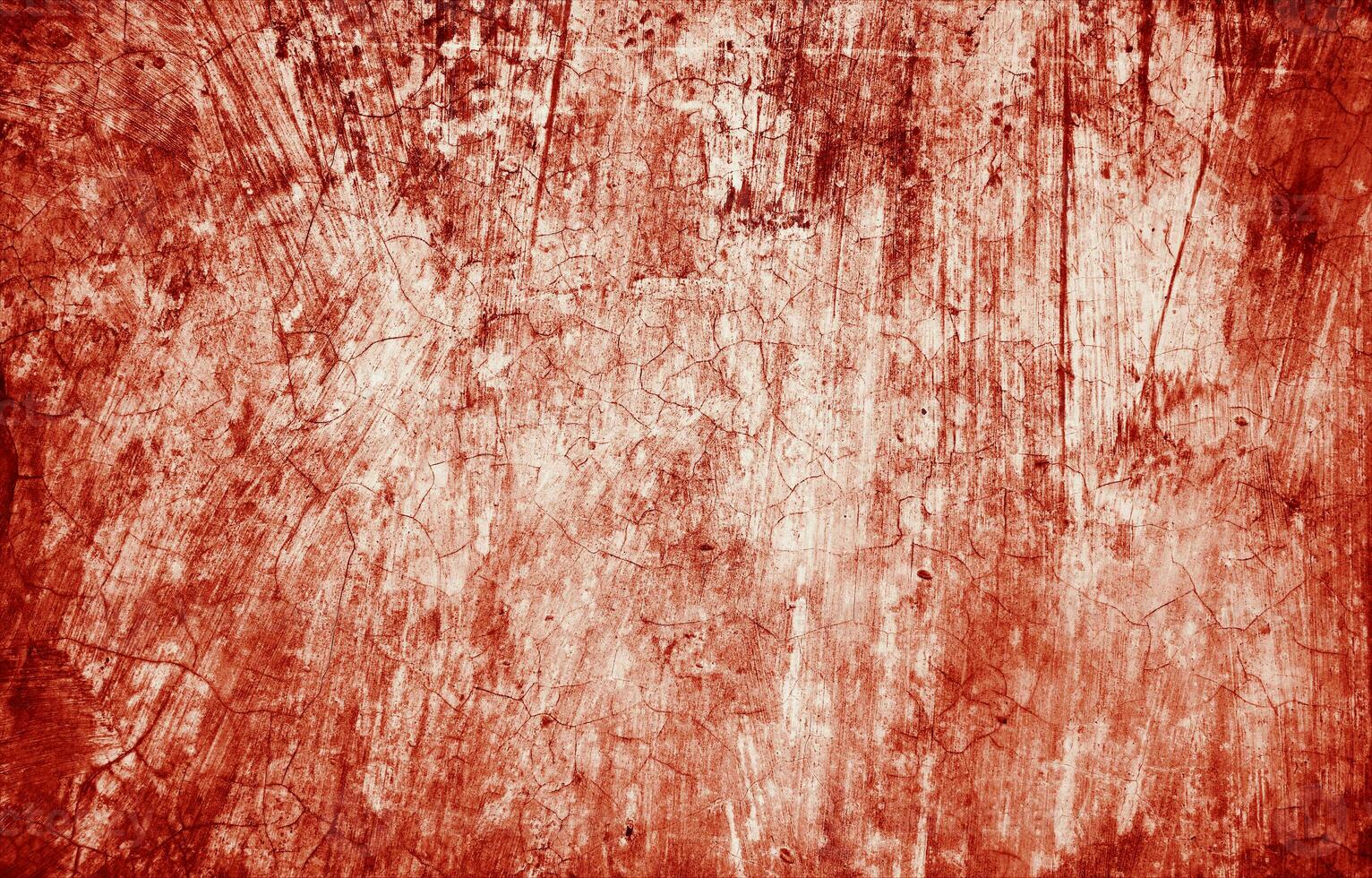 Splatters of red paint resemble fresh blood, their jagged edges contributing to a sense of unease. The stains, reminiscent of Halloween horrors. photo