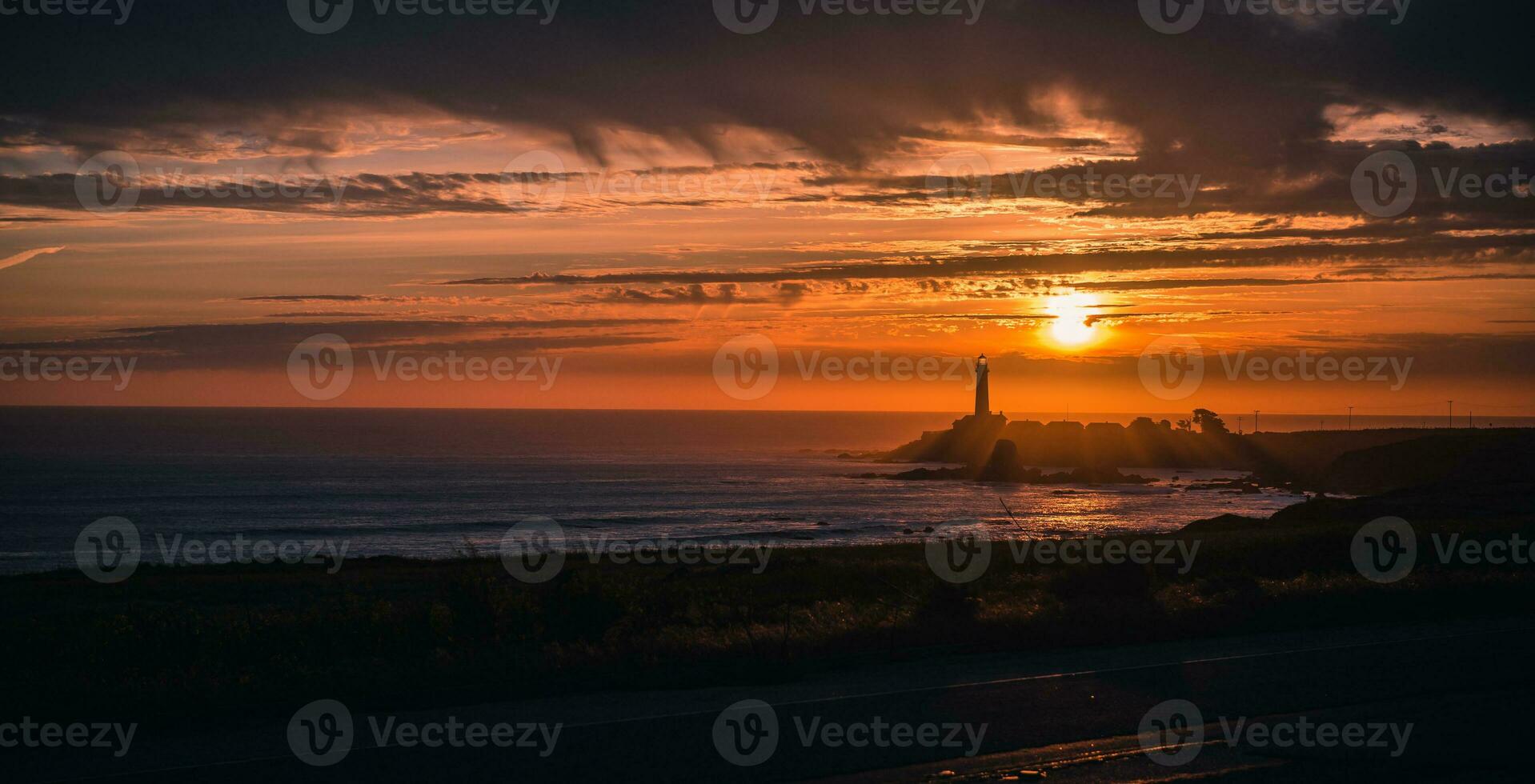 Lighthouse at sunset in California. photo