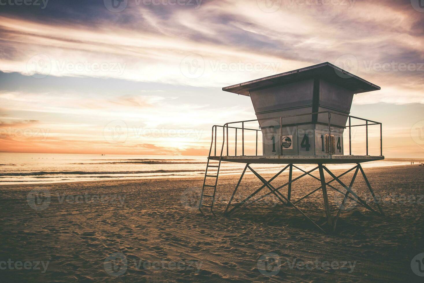 Lifeguard Tower at sunset near Ocean photo