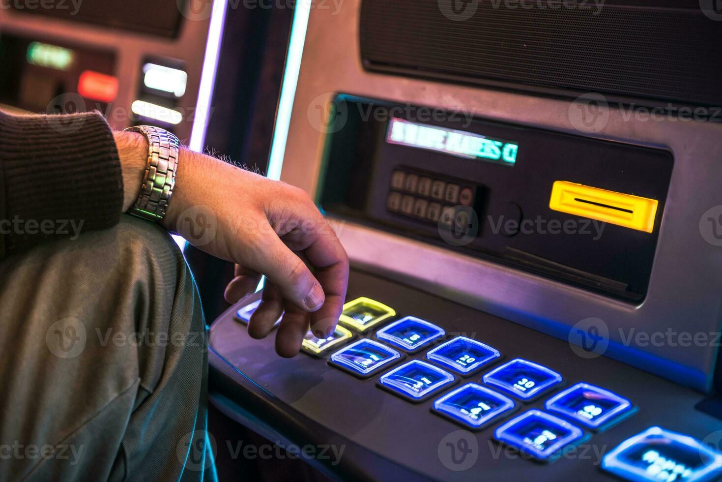 Men Playing Slot Machine photo