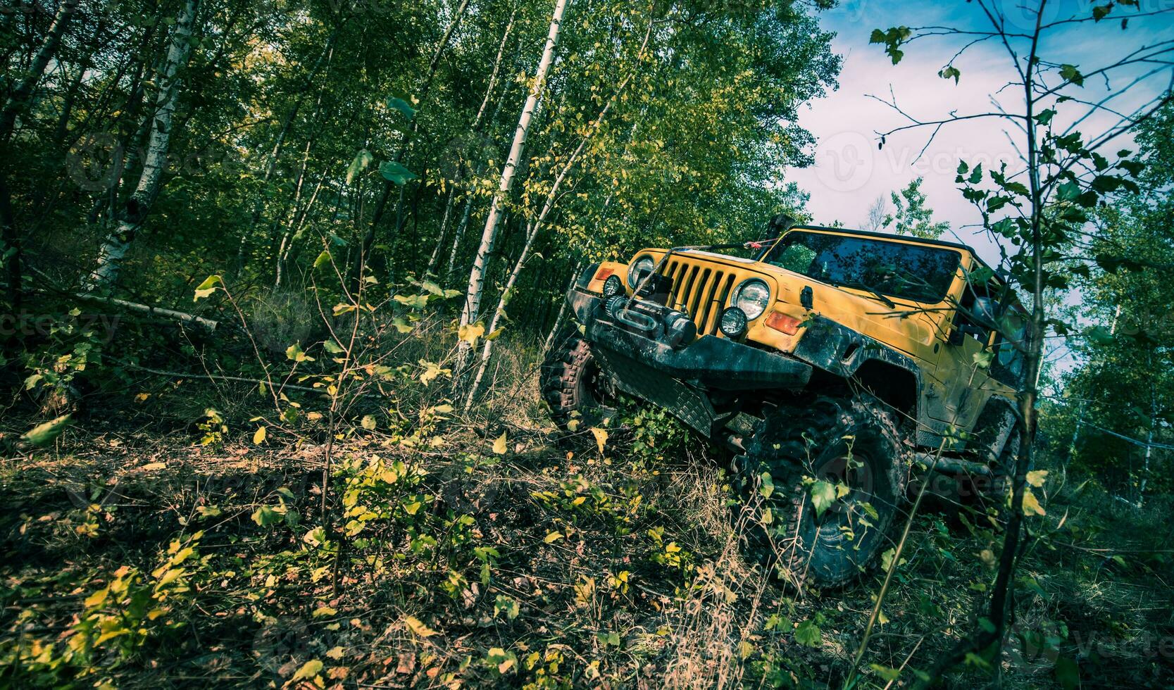 Yellow Off-Road Vehicle in the Terrain photo